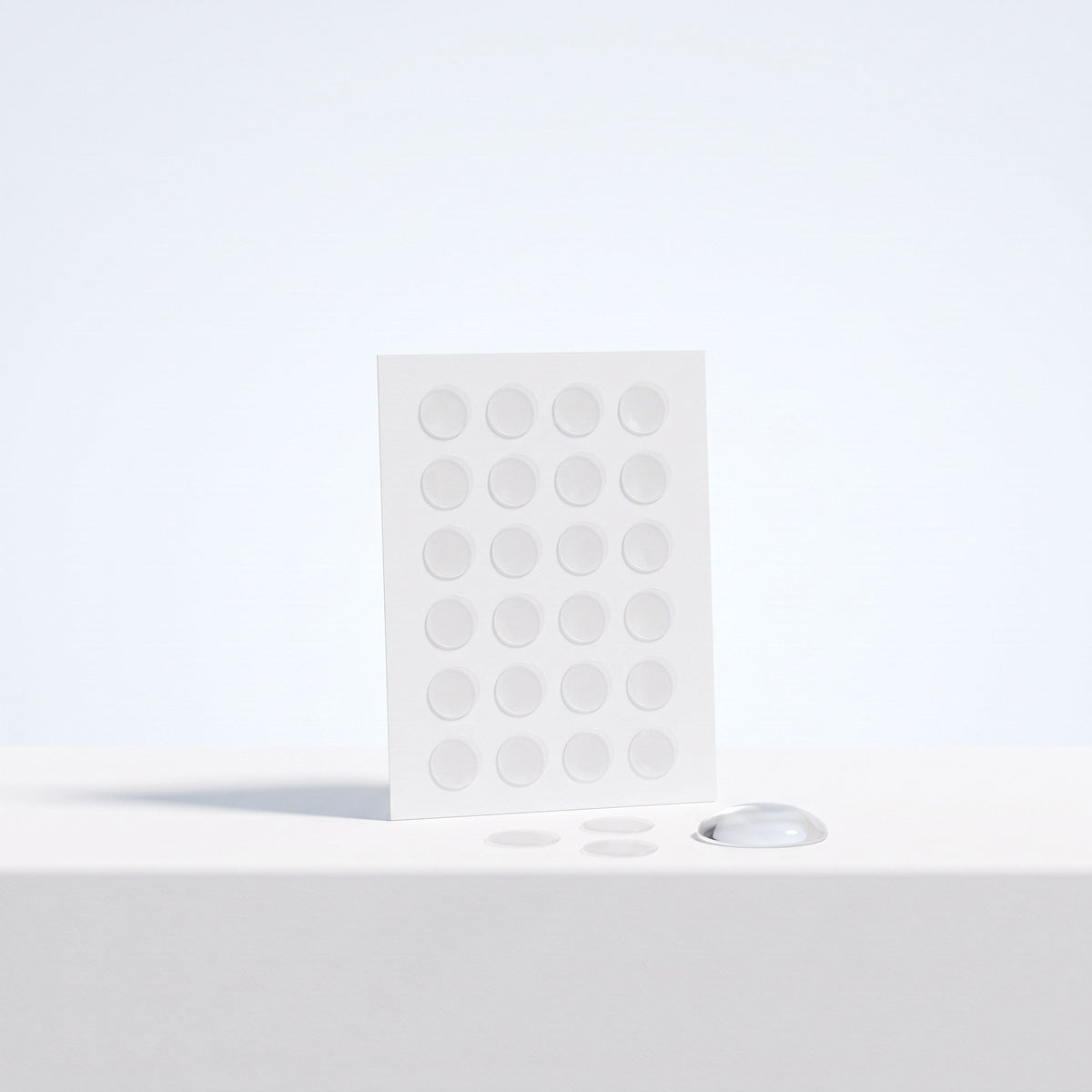 Sheet of clear spot patches with a drop of gel