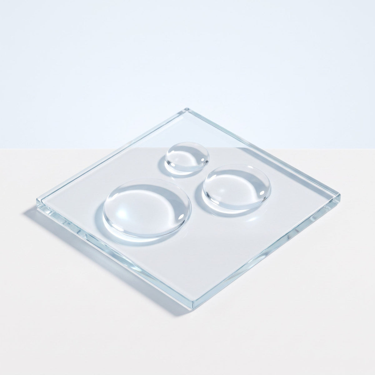 Clear serum drops on a glass slab