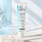 NIDA Ultimate Moisturizing Cream 100 ml, sobre piedra clara.